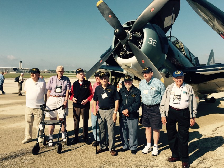 Crew of the USS Franklin and SB2C Helldiver in Milwaukee Wisconsin 17 July 2015 at the annual reunion. Left to Right William Schauer F1/c E-Div. Bernard Groenwold AMM2/c V-2nd -Div. Ray C. Bailey S2/c 6th -Div. PH1/c Ret. Roy Malmquist Navy Veteran and Friend of Crew Harold E. Rausch PC3/c K-Div. Gilbert E. Baca S1/c K-Div. John C. (Jack) Hensel ARM3/c VT-5 Donald Conard F1/c B-Div.